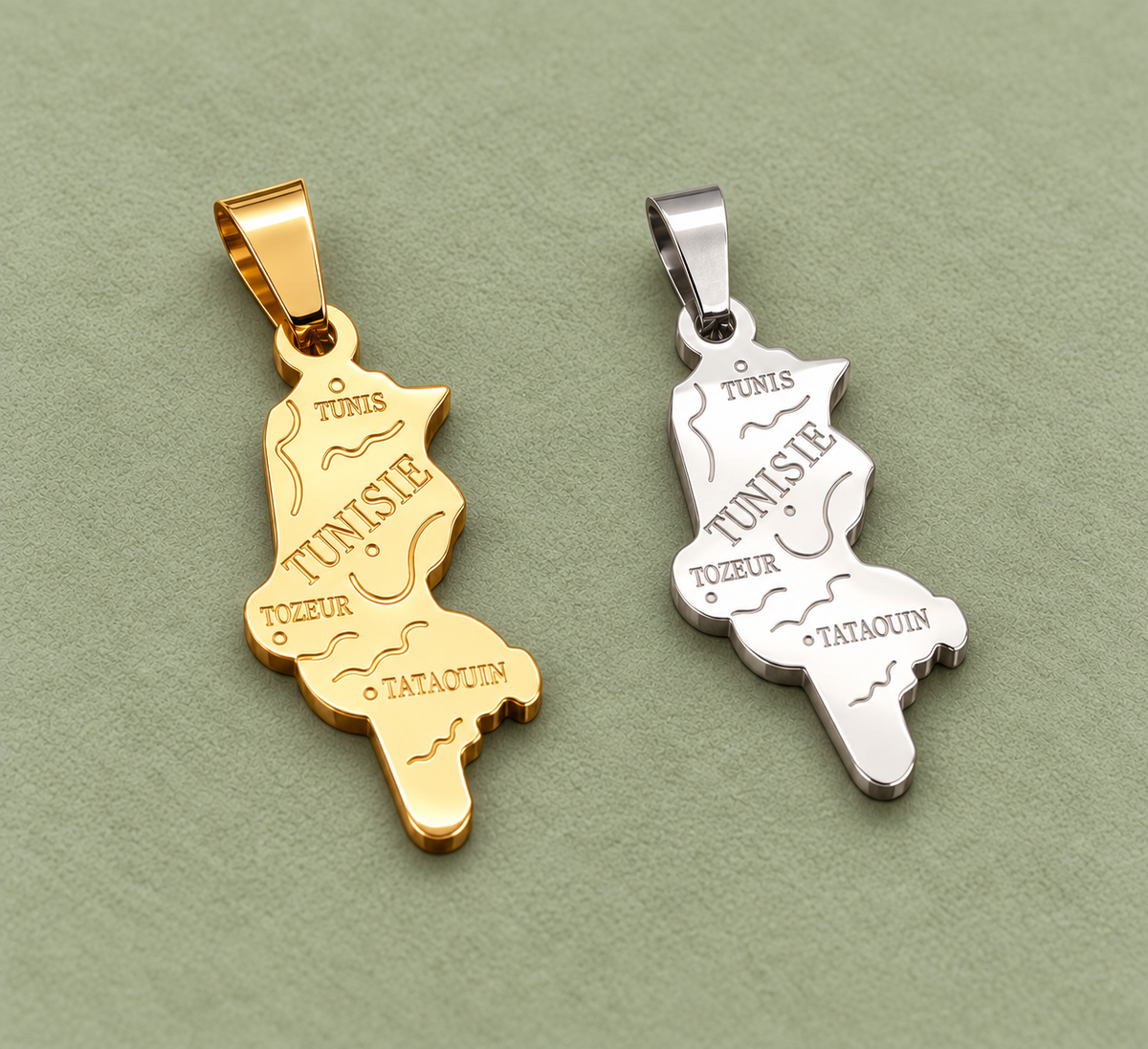 Pendentif carte Tunisie – Doré et argenté sur fond vert sauge