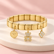 Bracelet Bella doré extensible – Ourson sur support ivoire